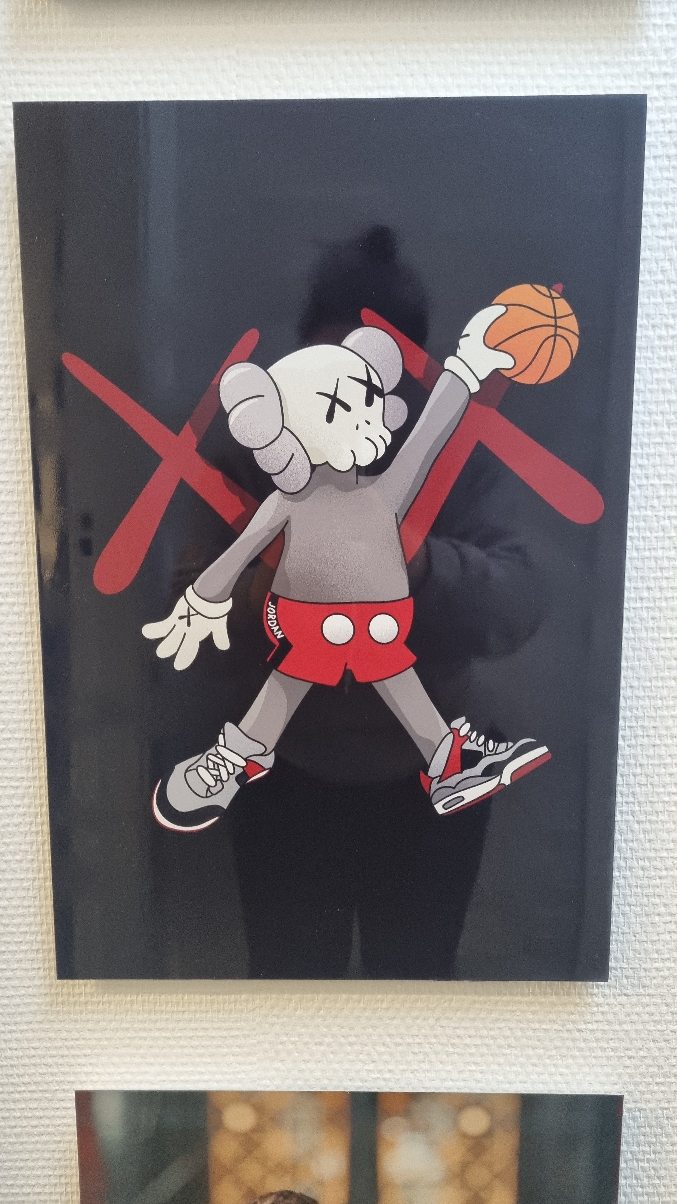 KAWS plays basketball